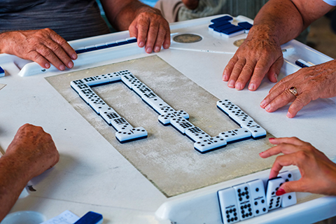 A stock photo of a domino game on Calle Ocho in Miami, Florida.
